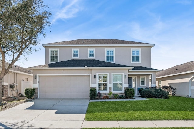 front of property featuring a garage and a front lawn