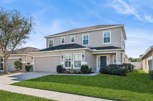 front facade featuring a front yard and a garage