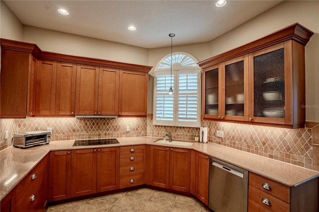 kitchen with pendant lighting, sink, tasteful backsplash, stainless steel dishwasher, and black cooktop