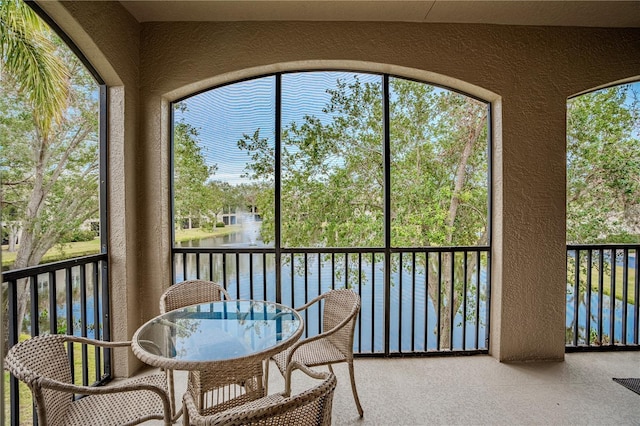 sunroom with a water view