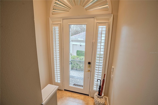 doorway featuring light tile patterned floors