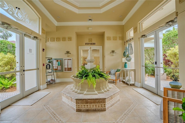 sunroom / solarium featuring french doors and a raised ceiling