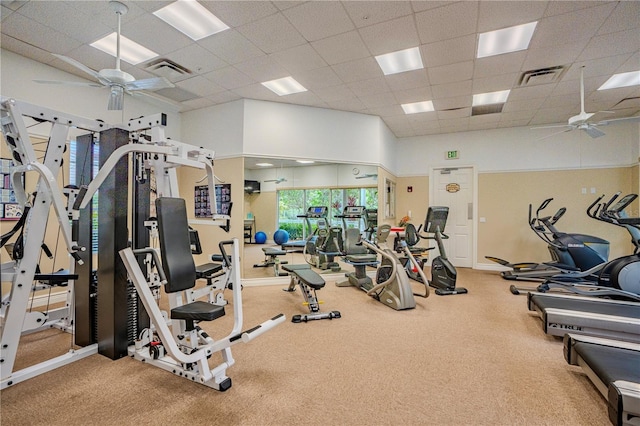 gym featuring carpet floors, a paneled ceiling, and ceiling fan