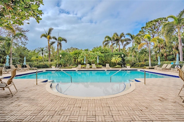 view of swimming pool with a patio