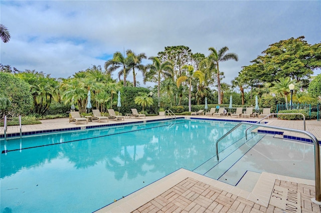 view of swimming pool featuring a patio area