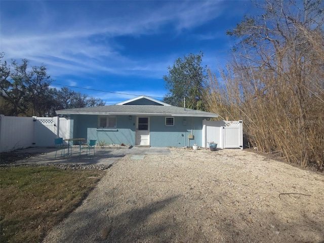 back of property featuring a patio