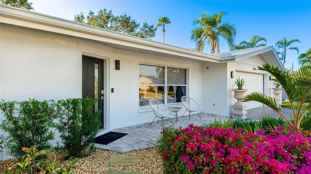 entrance to property featuring a garage