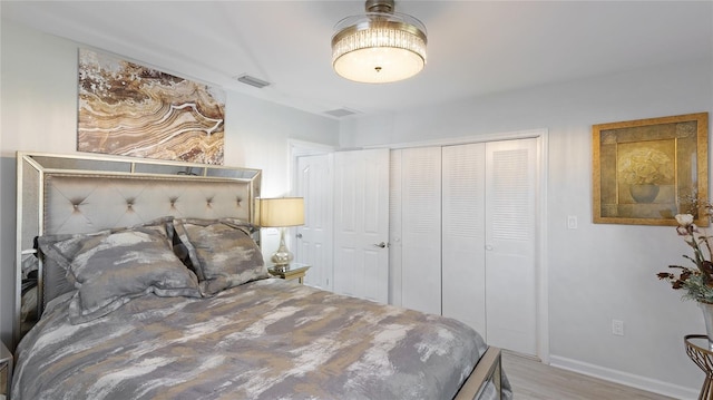 bedroom featuring a closet and hardwood / wood-style flooring