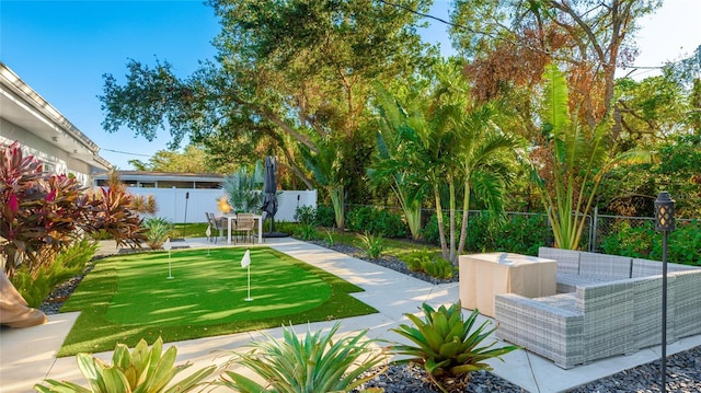 view of home's community with a patio area and an outdoor hangout area