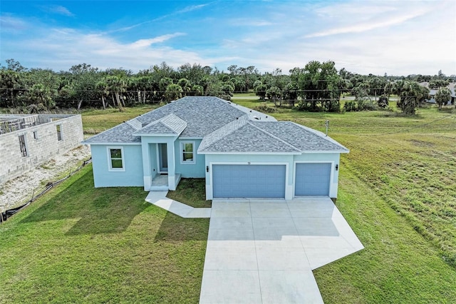 view of front facade with a front lawn and a garage