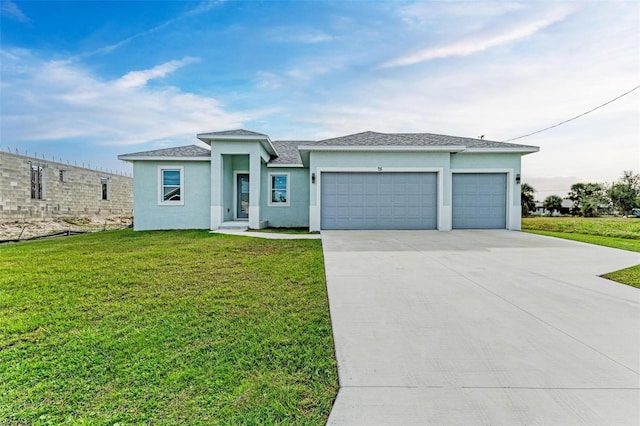 view of front of house featuring a garage and a front yard