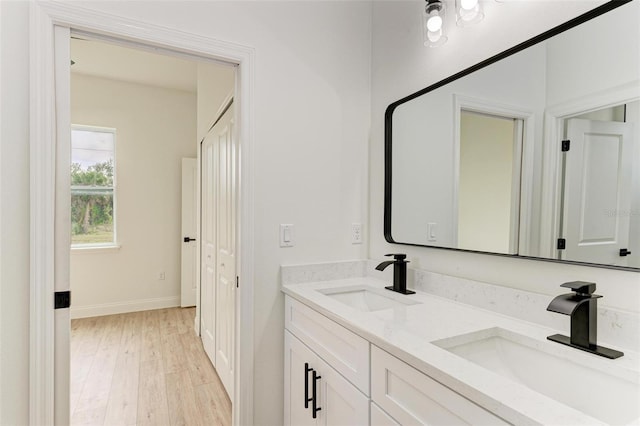 bathroom featuring hardwood / wood-style floors and vanity