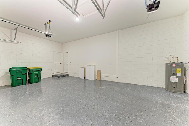 garage featuring water heater and a garage door opener