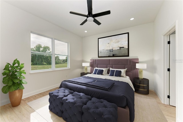 bedroom featuring light hardwood / wood-style floors and ceiling fan