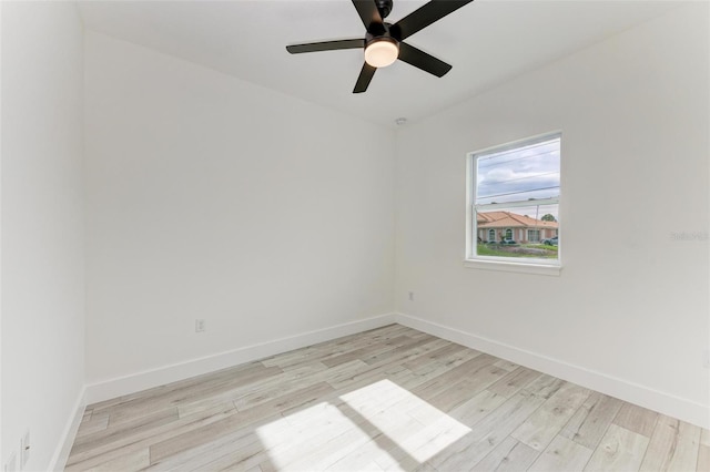 empty room with light hardwood / wood-style floors and ceiling fan