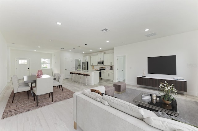 living room featuring light wood-type flooring