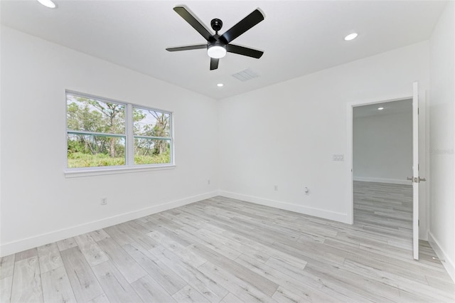 spare room featuring ceiling fan and light hardwood / wood-style floors