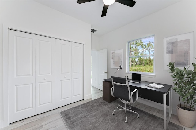 office featuring light hardwood / wood-style floors and ceiling fan