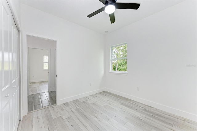 spare room with ceiling fan and light hardwood / wood-style floors