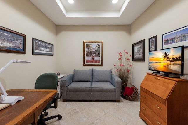 office space featuring a tray ceiling