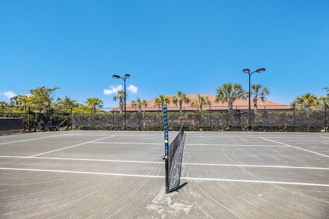 view of tennis court with basketball court