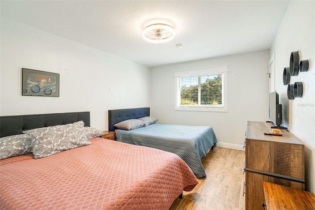 bedroom with light hardwood / wood-style floors