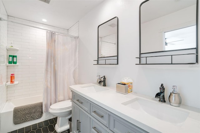 full bathroom featuring shower / bath combo with shower curtain, tile patterned flooring, vanity, and toilet