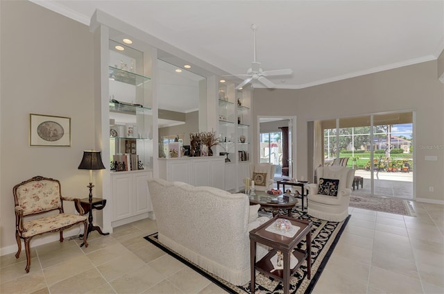 tiled living room featuring ceiling fan and ornamental molding