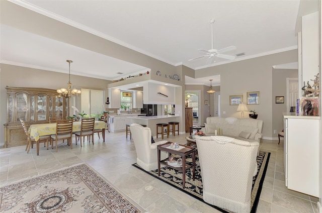 living room with ceiling fan with notable chandelier and ornamental molding