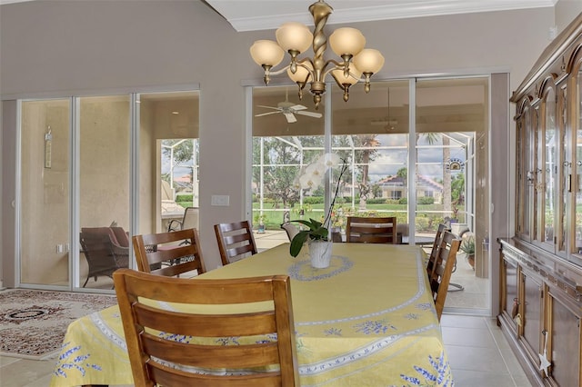 dining space with ceiling fan with notable chandelier, light tile patterned floors, and ornamental molding