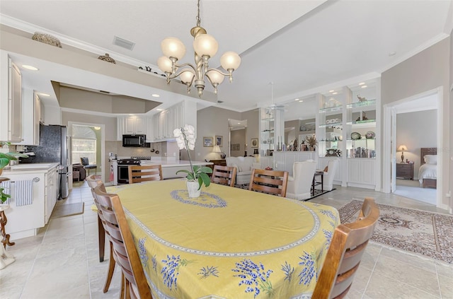 dining room with light tile patterned floors, an inviting chandelier, and crown molding