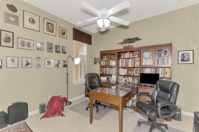 office space featuring ceiling fan and light colored carpet