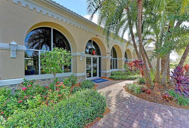 view of exterior entry featuring french doors