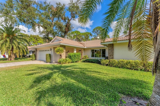 view of front of property with a garage and a front lawn