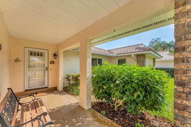 entrance to property with a patio