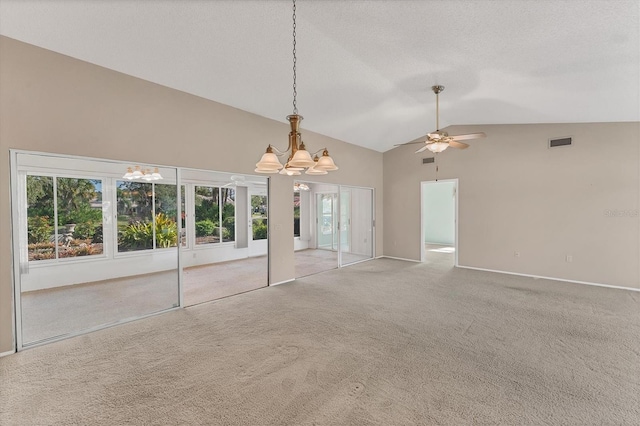 unfurnished living room featuring a textured ceiling, light carpet, ceiling fan with notable chandelier, and lofted ceiling