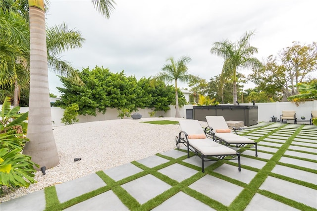 view of patio / terrace featuring a hot tub