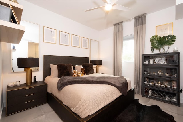 tiled bedroom with ceiling fan