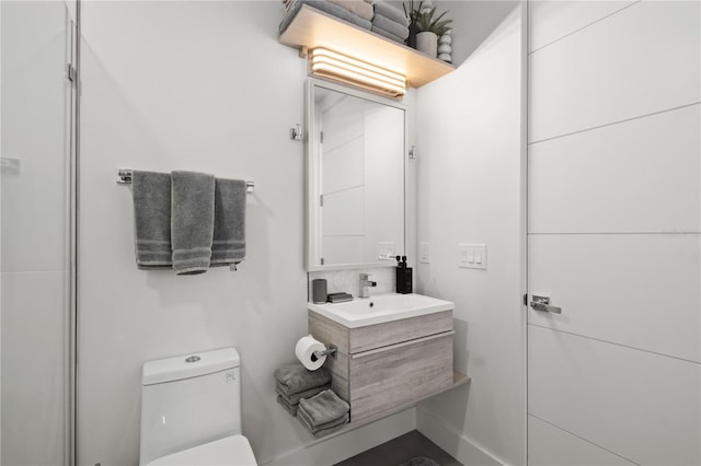 bathroom with vanity and toilet