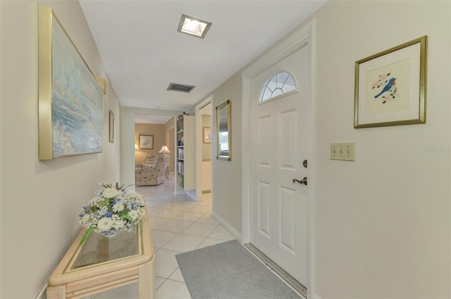 foyer with light tile patterned flooring