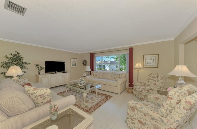 living room featuring light hardwood / wood-style flooring and ornamental molding