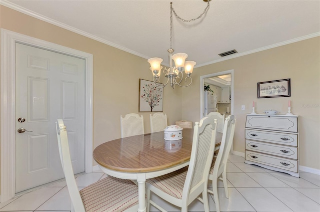 dining space with light tile patterned flooring, a chandelier, and ornamental molding