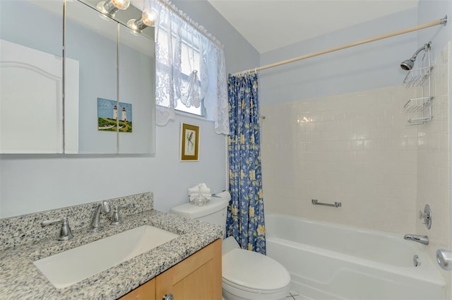 full bathroom with shower / tub combo with curtain, vanity, and toilet