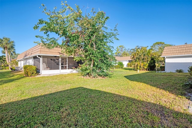 view of yard with a sunroom