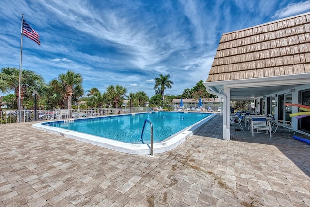 view of swimming pool with a patio area