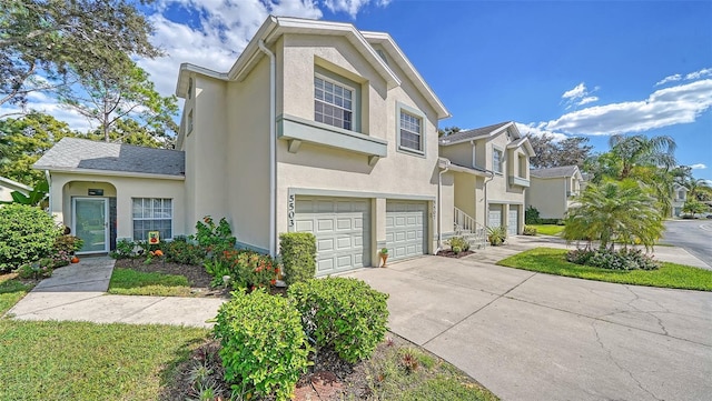 townhome / multi-family property featuring a garage