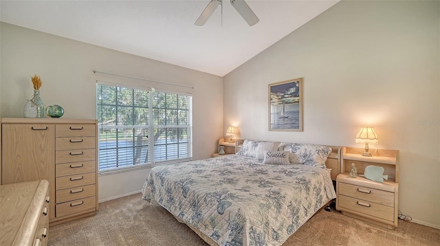 carpeted bedroom with vaulted ceiling and ceiling fan