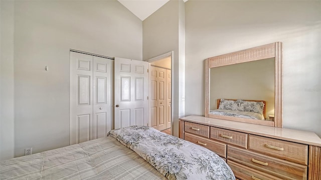 bedroom featuring high vaulted ceiling