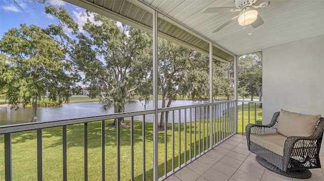 unfurnished sunroom featuring a water view