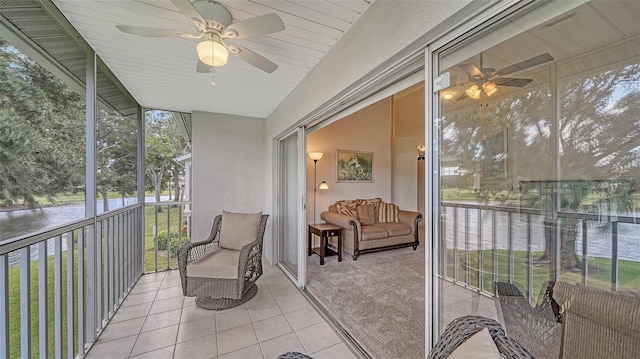 sunroom / solarium with a wealth of natural light and a water view